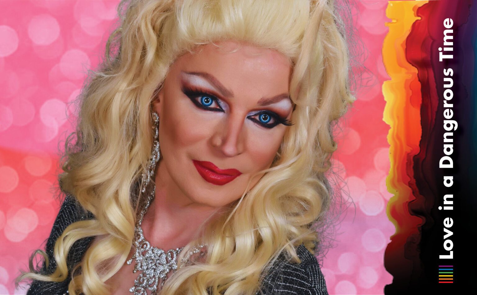 A headshot of drag queen Carlotta Gurl with a large blonde wig and make up