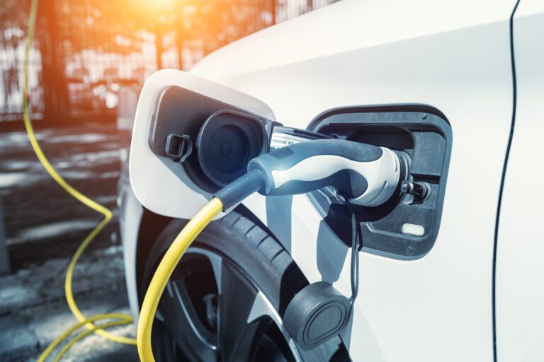 An electric car plugged in to charge.