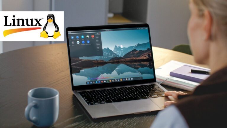 A man sits infront of a laptop beside the Linux logo