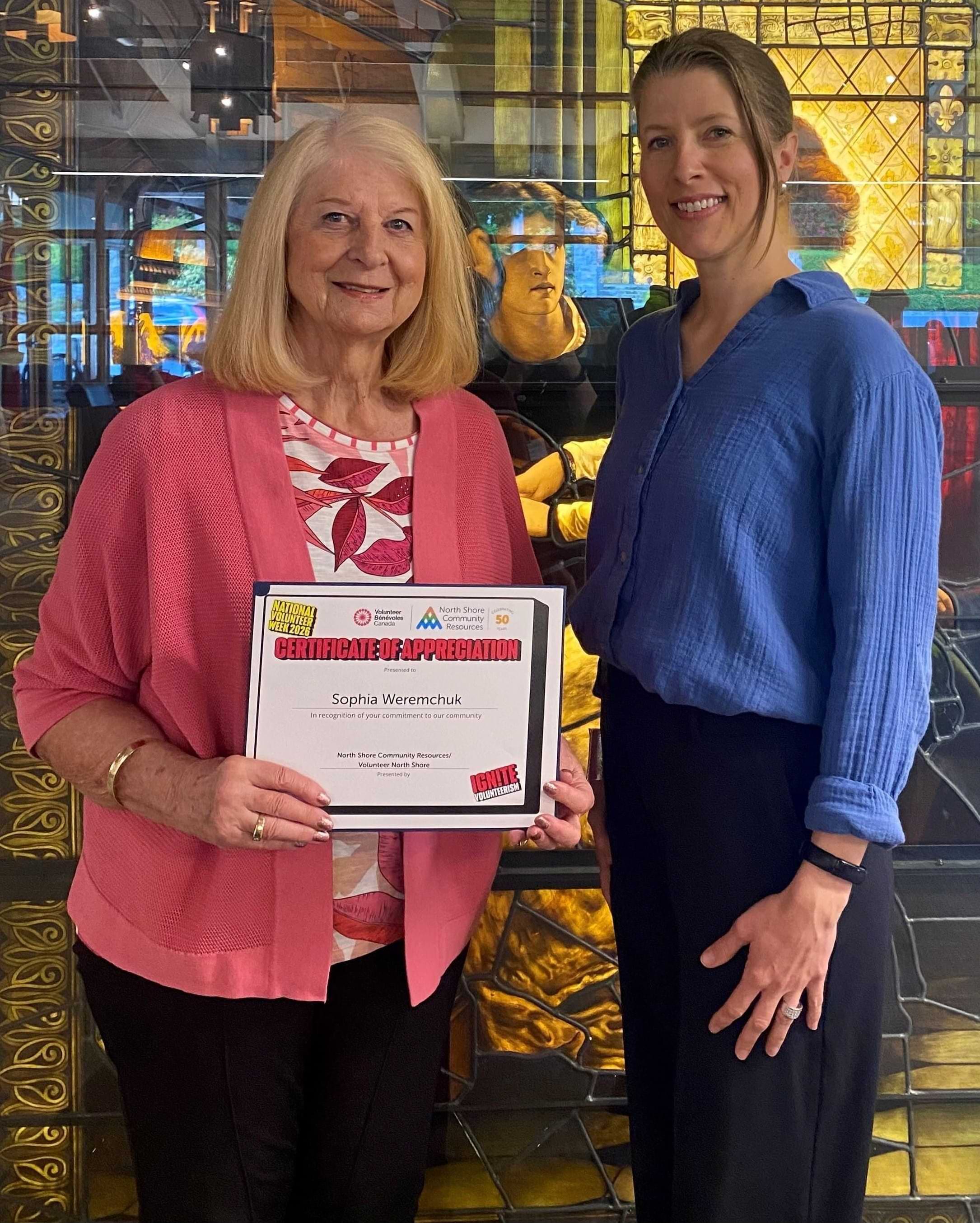 Friends of West Vancouver Memorial Library member holding her volunteer award