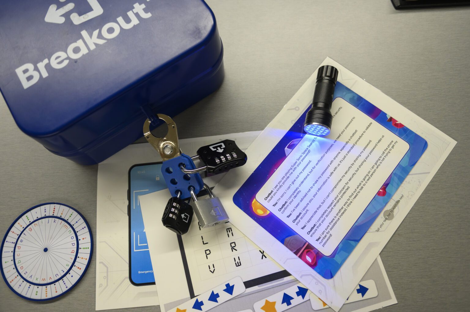 A UV flashlight lays over a number of clue cards. 
